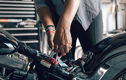 Mechanic Repairing Motorcycle